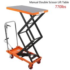 an orange scissor lift table on wheels with the words manuals below it