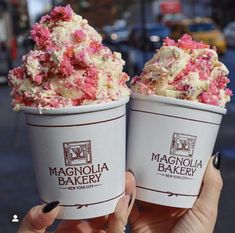 two ice cream cones with pink and white toppings