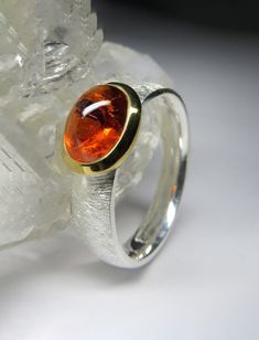 18K gold plated and scratched sterling silver ring with natural Spessartine Garnet gemstone origin - Madagascar stone measurements - 0.16 x 0.24 x 0.31 in / 4 x 6 x 8  mm stone weight - 1.2 carat ring weight - 4.52 grams ring size - 7.25 US  ref No 2070 Worldwide shipping from Berlin, Germany 2 Carat Ring, January Birthstone, Birthstone Gifts, Silver Jewelry Rings, Mens Pendant, Unisex Ring, Unisex Jewelry, Garnet Gemstone, Blue Gemstones