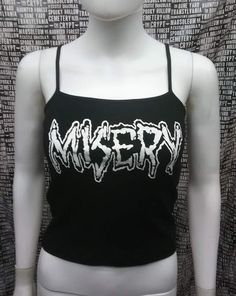 This is a black official Misery crop tank top with spaghetti straps. This has a Misery image screen printed on the front. 57% cotton/ 38% polyester/ 5% SpandexThese are handmade screenprinted and slightly vary from the photo. Please feel free to email me any questions. Thanks for looking.Due to an influx of incorrect addresses if a package is returned,  you must pay the shipping cost to resend the item to you.I do not do exchanges and I do not take returns unless the item is damaged. I thoroughl Corset Fashion Outfits, Hoodie Diy, Crust Punk, Crop Vest, Black Cropped Tank, Vest Crop Top, Black Crop Top Tank, Tank Outfit, Cropped Vest