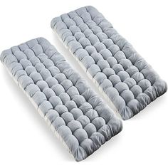 two gray pillows sitting on top of each other