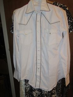 970S mens Miller western wear  pearly snap buttons western shirt   1970   mens 'white with brown trim size..15-34 white w brown trim  pearly snap buttons FLAP POCKETS made in DENVER  COL Brown Trim, Lady And The Tramp, Western Shirt, Disney Ladies, Mens Oxfords, Western Shirts, Vintage Boho, Western Wear, Vintage Men