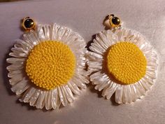 natural raffia sunflower and clip on earrings Hangs nice and noticable size at 3.5 inches  Large and light style Very ligtweight Would pair great with any color. popping design One of a kind Very natural and classy style Handmade custom clip on closure Handmade Flower Earrings For Beach In Summer, Summer Flower Earrings With Sunflower Design, Summer Sunflower Design Earrings, Summer Sunflower Design Flower Earrings, Light Style, Classy Style, Pop Design, Fashion Lighting, Chicago Il