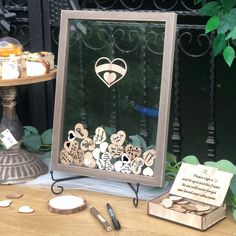 a table topped with lots of different types of items on top of a wooden table