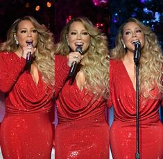 three women in red dresses singing into microphones at a christmas concert with lights behind them