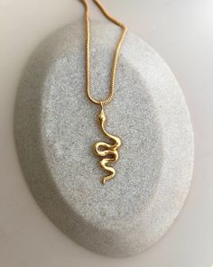 Beautiful gold plated necklace with a gold plated snake pendant. The chain is completely gold plated with 24k gold, the total length of the necklace is 46 cm. The gold-plated snake chain is 2 mm thick. The gold-plated carabiner is 1 cm long. The chain can be extended by a further 4 cm. The great, gold-plated snake pendant has a length of 4 cm and a width of 1.5 cm. The gold-plated necklace was handmade with lots of love and from high-quality materials. This necklace has an exciting statement des Large Snake, Gold Snake Chain, Snake Pendant, Gold Necklaces, Gold Snake, Pendant Gold, Gold Plated Necklace, Snake Chain, Gold Plated Jewelry