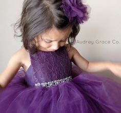 This dress is a show stopper! A flower girl dress fit for a real life princess! The color is eggplant or dark purple with a lace and satin vintage inspired bodice. It is fully lined with soft fabric for comfort. The tulle does not touch the skin. This dress is made with yards and yards of tulle skirt for maximum poof. Please note this dress is all one piece the tulle sewn onto the bodice it is NOT tied together. This dress is made to last so that more memories can be made. We aim to make the bes Elegant Purple Princess Dress For Pageants, Elegant Purple Princess Dress For Pageant, Purple Tulle Dress For Dress-up, Elegant Purple Tutu Dress For Wedding, Purple Fitted Princess Dress For Pageant, Purple Tulle Dress With Lace Bodice, Purple Tulle Tutu Dress For Dress-up, Princess Style Purple Tutu Dress For Wedding, Purple Tulle Princess Dress For Dress-up