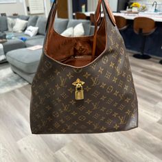 Discontinued Authentic Lv Bag In Great Condition. Designer Shoulder Bag With Lock For Daily Use, Luxury Brown Shoulder Bag With Lock, Luxury Hobo Bag With Branded Hardware, Brown Bag With Lock For Daily Use, Brown Bag With Lock For Everyday Use, Brown Everyday Bag With Lock, Brown Bags With Lock For Everyday Luxury, Luxury Hobo Bag With Gold-tone Hardware For Errands, Brown Tote Bag With Lock