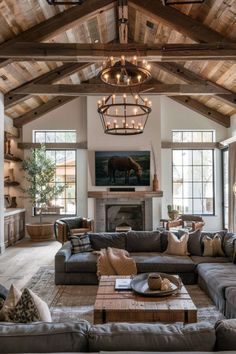 a living room filled with lots of furniture and a fire place in the middle of it