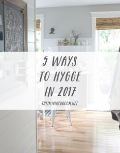 a room with white walls and wood floors, the words 5 ways to hygge in 2017