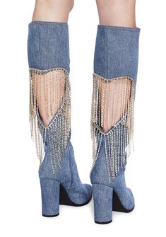 cuz let's party. These boots have a denim construction, a cut out heart design with rhinestone fringe on the back, a pointed toe design, block heels, and side zipper closures. Fall Party Denim Blue Jeans, Denim Pointed Toe Boots For Party, Trendy Fringe Boots For Party, Trendy Party Boots With Fringe, Spring Boots With Rhinestone Fringe, Chic Denim Blue Jeans For Party, Denim Blue Pointed Toe Party Boots, Party Denim Blue Pointed Toe Boots, Party Jeans With Rhinestone Fringe