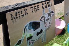 there is a sign that says milk the cow