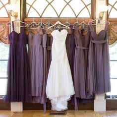 the bride's dresses are hanging up in her bridal suite