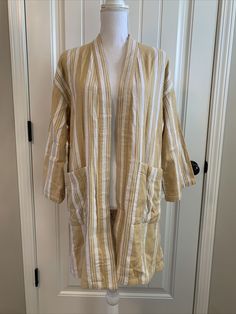 New Eileen Fisher Striped Organic Cotton Doubleweave Kimono Jacket Reed mustard yellow and cream white Size XXS/XS TTP/TP SIZE & FIT Easy fit About 35.5" from shoulder to hem Model shown is 5'10" (177cm) wearing US size Small Details: Signature kimono silhouette updated in jaunty stripes. Open front Dropped shoulders Three-quarter sleeves Waist patch pockets Organic cotton Machine wash Imported Comes from smoke and pet free home. Spring Long Sleeve Cardigan With Patch Pockets, Casual Spring Cardigan With Patch Pockets, Cream Linen Long Sleeve Outerwear, Casual Cream Linen Outerwear, Kimono Jacket, Eileen Fisher, Three Quarter Sleeves, Mustard Yellow, Priority Mail