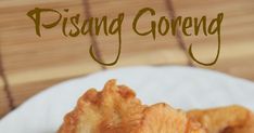 some food is on a white plate with the words pisang goreng