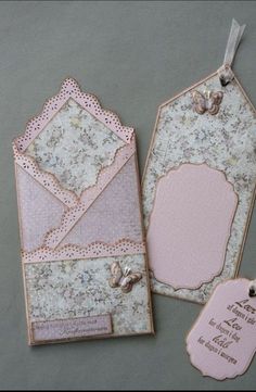 two tags with lace on them are sitting next to each other and one has a tag attached to it