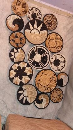 a wall hanging with many circular designs on it