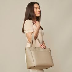 This structured tote is the ultimate do-it-all bag that you deserve. It's the perfect carryall for work, travel, and anywhere your day brings you. It features a spacious and organized interior for your essentials, a padded compartment for your laptop, side pockets for your drinks, and you can convert it into a backpack or crossbody. Crafted from premium American Saffiano leather that's waterproof and scratch-resistant, the Transform Tote will stay just as beautiful through all your travels and a Modern Weekender Bag With Removable Pouch For On-the-go, Chic Tote Laptop Bag For On-the-go, On-the-go Tote Bag With Laptop Sleeve, Versatile Everyday Travel Bag With Top Handle, Chic Rectangular Laptop Bag For On-the-go, Trendy On-the-go Tote Laptop Bag, Versatile Top Handle Laptop Bag For Travel, Trendy Tote Laptop Bag For Travel, Trendy Laptop Tote Bag For Travel