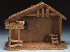 a nativity scene made out of wood and straw