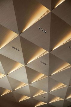 the ceiling is made up of many different shapes and sizes, with dim lighting on each side