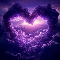 a heart shaped cloud formation in the sky with purple hues and clouds around it