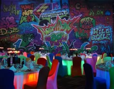 a room filled with tables and chairs covered in neon lights