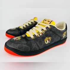 Gucci -Condition: Brand New Item With Original Box + Dust Bag. -All Of Our Items Are 100% Authentic. -Size: Men's Uk 12 - Us 12.5 - Eu 46 (True To Size). -Code: 703151 -Color: Black / Yellow / Orange -Model: Gucci Gg Supreme H2o Tiger Head -Black Gg Supreme Canvas, With Tiger Print. -Oval Enameled Detail With Metal Double G. -Label With Gucci Vintage Logo. -Rubber Sole. -Lace-Up. -Made In Italy. -Retails For $945.00 -Item Ships Out Within 24 Hours. Designer Black Custom Sneakers With Logo Print, Luxury Gucci Sneakers With Rubber Sole, Gucci Luxury Custom Sneakers With Rubber Sole, Gucci Custom Black Sneakers With Round Toe, Luxury Gucci Sneakers With Logo, Gucci Custom Leather Sneakers With Logo Print, Gucci Black Custom Sneakers With Round Toe, Gucci Leather Custom Sneakers With Logo Print, Black Designer Gucci Custom Sneakers