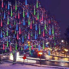 a large christmas tree with lights all over it