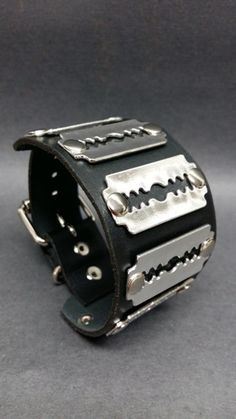 Edgy Black Cuff Bracelet With Rivets, Punk Leather Jewelry With Rivets, Punk Style Leather Strap Bracelets, Punk Style Leather Bracelet With Rivets, Punk Leather Bracelet With Rivets, Punk Leather Strap Bracelets, Edgy Leather Bracelet For Concerts, Punk Style Silver Leather Wristband, Punk Leather Bracelet With Studs