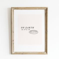 a framed print with the words on earth as if he's happy