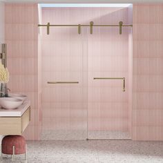 a bathroom with pink walls and tile flooring next to a walk - in shower