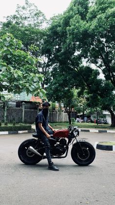 a man riding on the back of a motorcycle