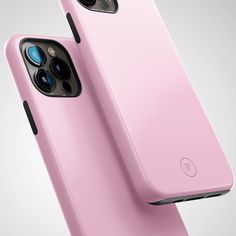 two pink iphones sitting side by side on top of each other, one is facing the camera