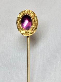 Vintage Cabochon Amethyst Stickpin in a 14K gold chased frame. Gorgeous color Amethyst stone. 9x6 Bezel Set. #9387 etched for Estate Date in underside. Stickpin weighs 1.6 Grams Stickpin is 2 1/4 inches in length. Pin head is 1/2 inches in length and 1/2 inches wide. Conversion to a ring available. Add $75.00 to price. You will receive finished produce in 1 week time. Formal Yellow Gold Cabochons With Bezel Setting, Classic Gold Gemstone Cabochons, Gold Elegant Cabochons With Bezel Setting, Luxury Gold Gemstone Cabochons, Elegant Gold Cabochons With Bezel Setting, Vintage Oval Gold Cabochons, Vintage Yellow Gold Cabochons For Gift, Vintage Yellow Gold Cabochons As Gift, Gold Gemstone Cabochons For Anniversary