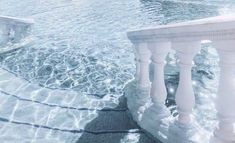 an icy pool with steps leading up to it