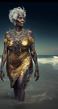 an old woman walking in the water at the beach with her hair pulled back and tattoos on