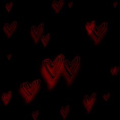 many red hearts on black background