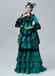 18th Century Victorian Bustle Dress Rococo Marie Antoinette Costume  Color:Green  Material: This dress made of High Quality Satin, soft,smooth and comfortable to wear  Sleeve Length:  Long Sleeve  Dresses Length:Floor Length  Neckline:  Square Collar  Decoration: Ruffles + Lace  Package Includes:  Dress + Hat    The length of skirt about 45 inches (114 cm) long from waist to hem regardless of size. This dress is pictured with a 6-hoop skirt Petticoat underneath to achieve the look. Petticoa Long Sleeve Victorian Dress For Banquet, Green Gothic Dress For Costume Party, Baroque Victorian Dress With Ruffles For Parties, Baroque Ruffle Dresses For Costume Party, Victorian Long Sleeve Party Dress, Gothic Green Dress For Costume Party, Long Sleeve Victorian Vintage Dress For Banquet, Elegant Green Victorian Dress For Costume Party, Baroque Fitted Dress For Theater