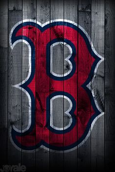 the boston red sox logo is painted on a wooden wall with dark wood planks