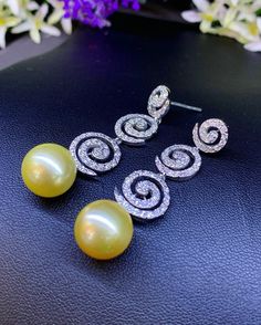 We are presenting you A UNIQUE PAIR OF HUGE 13.5MM SOUTH SEA PEARLS with LUSTROUS GOLDEN color. SET IN HANDCRAFTED, 18K SOLID GOLD Chandelier EARRINGS. ACCENTED WITH 132 F/VS, SPARKLING ROUND BRILLIANT DIAMONDS! Set in 18K Solid White Gold earrings! IN CASE OF RETURN FOR US BUYERS. BUYERS MAY SEND THE ITEMS BACK TO OUR US-BASED OFFICE IN SALT LAKE CITY, UTAH ONLY ONE ITEM AVAILABLE!! NO DUPLICATES!! WHAT YOU SEE IN THE PICTURES IS WHAT YOU WILL GET SOLIDLY HANDCRAFTED EARRINGS! SUGGESTED RETAIL Elegant Pear-shaped Yellow Earrings, Elegant Yellow Pear-shaped Earrings, Diamond Pearl Earrings For Party, Luxury White Gold Pearl Earrings For Party, White Gold Round Pearl Earrings For Party, Party Pearl Drop Earrings, Elegant Yellow Earrings For Party, Elegant Yellow Bridal Earrings For Wedding, Elegant Yellow Earrings For Evening