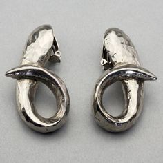 Features: - 100% Authentic ALEXIS LAHELLEC. - Massive modernist silver earrings. - Silver tone hardware. - Signed ALEXIS LAHELLEC. - Clip back earrings. - Minor oxidation. - Very good vintage condition. Measurements: Height: 2.12 inches (5.4 cm) Width: 1.06 inches (2.7 cm) Weight per Earring: 11 grams * These earrings will be shipped via DHL Express Shipping with tracking number. Please convo me for any queries and additional photos. Thank you for visiting. Other Fees that buyers need to know: P Contemporary Silver Evening Earrings, Contemporary Silver Earrings For Evening, Contemporary Oxidized Metal Earrings, Contemporary Silver Earrings With Oxidized Finish, Unique Silver Earrings For Evening, Modern Silver Plug Earrings For Formal Occasions, Modernist Silver Metal Earrings, Modernist Silver Pierced Earrings, Silver Modernist Earrings