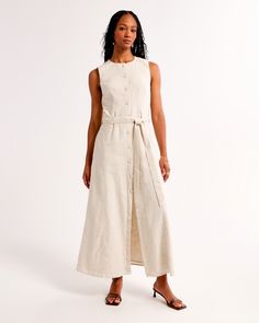 Flattering midi dress in our soft linen-blend fabric and relaxed-fit silhouette, featuring a self-tie removable belted waist and functional button-through detail. Belted Linen Dress For Daywear, Spring Beige Belted Dress With Tie Waist, Belted Midi Linen Dress For Work, Summer Linen Belted Dress For Work, Beige Linen Midi Dress For Work, Beige Linen Dress With Tie Waist, Chic Linen Belted Midi Dress, Belted Linen Midi Dress For Day Out, Fitted Belted Linen Dress For Daywear