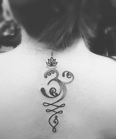 a woman with a crown tattoo on her back