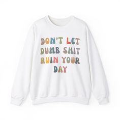 Don't Let Dumb Shit Ruin Your Day Sweatshirt, Motivational Therapy Sweatshirt, Mental Health Awareness Sweatshirt, Funny Sweatshirt 💫Ideal for any situation, a unisex heavy blend crewneck sweatshirt is pure comfort. 💫 Made with a medium-heavy fabric blend of 50% cotton and 50% polyester, this sweatshirt feels cozy and is the perfect choice for those colder months. 💫 Made using 100% ethically grown US cotton. Gildan is also a proud member of the US Cotton Trust Protocol ensuring ethical and su Casual Multicolor Screen Print Sweatshirt, Casual Multicolor Sweatshirt With Screen Print, White Cotton Sweater With Slogan, Multicolor Crew Neck Sweatshirt With Screen Print, Multicolor Long Sleeve T-shirt With Text Print, Multicolor Cotton Sweater With Letter Print, Relaxed Fit Crew Neck Sweatshirt With Funny Print, Casual White Sweatshirt With Funny Print, Multicolor Cotton Sweatshirt With Letter Print