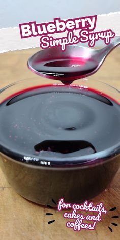 blueberry simple syrup is poured into a bowl