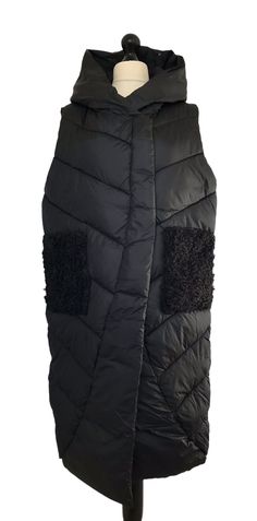 . In a thick warm quilted puffer fabric , longer length sleeveless gilet style with a quirky angled front bottom hem area and 2 fleece side hip pockets , concealed zip and press stud fastenings double the front . One size - to fit UK sizes 12 14 . Bust measures : 48 inches . Length from back of neck to bottom hem : 44 inches . Brand new with tags . Visit our shop for lots more gorgeous quirky lagenlook fashion !! Black Quilted Sleeveless Vest, Sleeveless Quilted Black Outerwear, Quilted Sleeveless Winter Vest, Black Quilted Vest For Winter, Sleeveless Black Outerwear With Fleece Lining, Puffer Gilet, Lagenlook Style, Womens Jackets, Front Bottoms