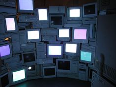 a room filled with lots of different types of tvs