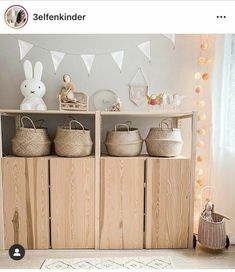 there are baskets on top of the shelves in this room, along with other items