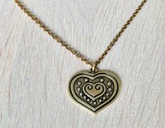 Kalevala jewelry bronze heart necklace. This gorgeous "Euran Sydän" (Eura Heart) bronze necklace would make a perfect gift for someone you love. Pendant width 3.2 cm (1.3"), length 3 cm (1.18") Chain length: 70 cm (approx. 27.6") Very good vintage condition. Comes in a small cardboard box like in the last photo making this a great gift! Kalevala Koru was established in 1937 and it is the most beloved jewelry company in Finland. Kalevala jewelry has always been hand-made in Finland by skilled art Kalevala Jewelry, Beloved Jewelry, Bronze Necklace, Love Pendant, Art Deco Necklace, Ancient Artifacts, Jewelry Companies, Christmas Gifts For Her, Heart Pendant Necklace