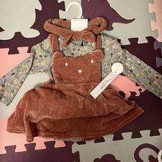 Cute Bear Overall Dress Very Soft With Floral Pattern Bodysuit With Free Bow With Tags! Brand Is Tahari Baby Size 6-9 Months Cute Fitted Brown Sets, Bear Cute, Tahari Dress, Month Colors, 9th Month, Cute Bear, Overall Dress, Baby Size, Cute Bears